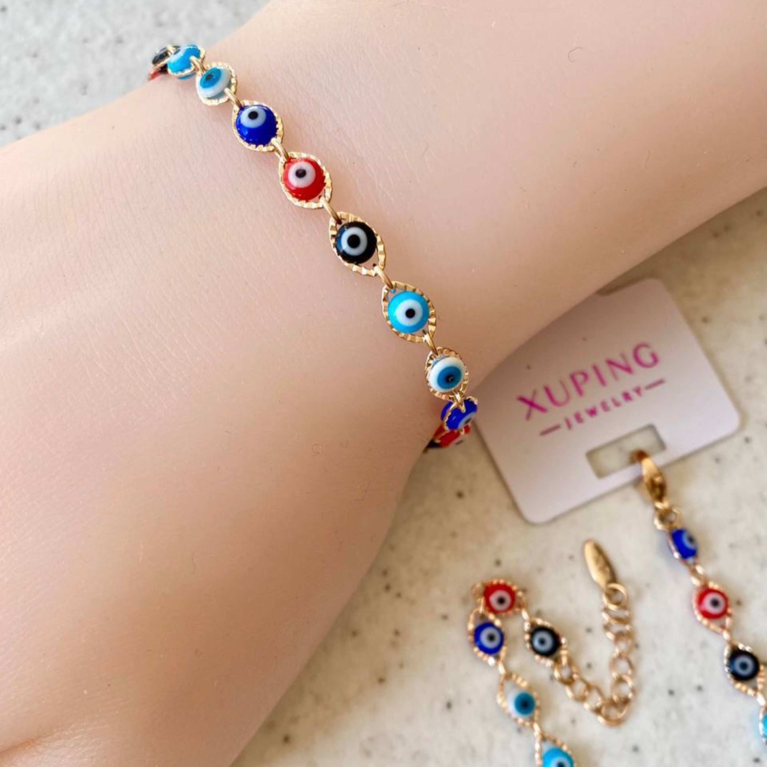 دستبند چشم نظر فقط  رنگارنگ موجوده مارک ژوپینگ  دور طلایی رنگ ثابت