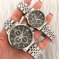 ست ساعت زنانه و مردانه مارک سیتیزن بند استیل نقره ای صفحه مشکی دارای تقویم تک موتوره طرح سه موتوره 