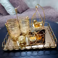 سینی آینه ای طلایی همراه قفس پرنده توپ جاشمعی جاقاشقی غرفه نارنجی