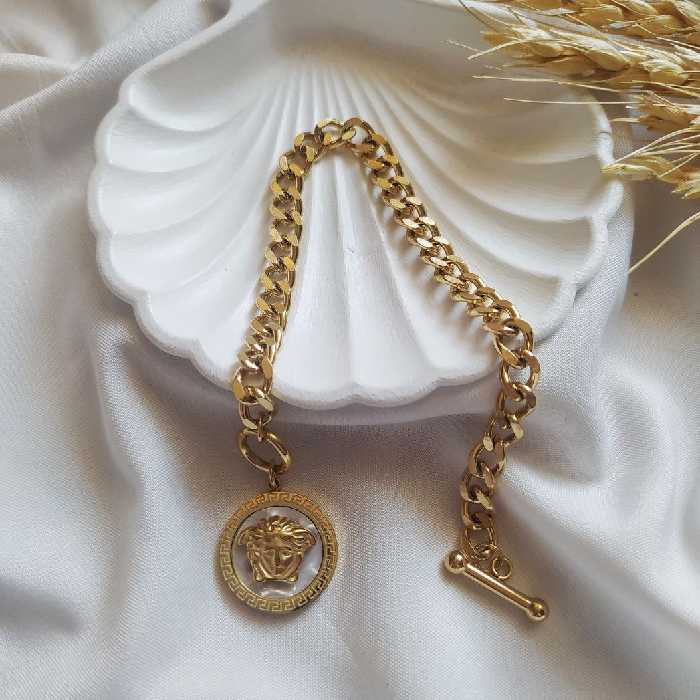 دستبند ورساچ قفل تی رنگ سفید جنس استیل رنگ ثابت (حتما قبل از ثبت سفارش موجودی بگیرید)