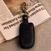 جاسوییچی چرم طبیعی گاوی مشکی مناسب کیا قفل گرد 4دکمه