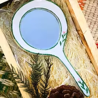 آینه دسته دار دستساز لعابی ساخته شده به روش زیرلعابی