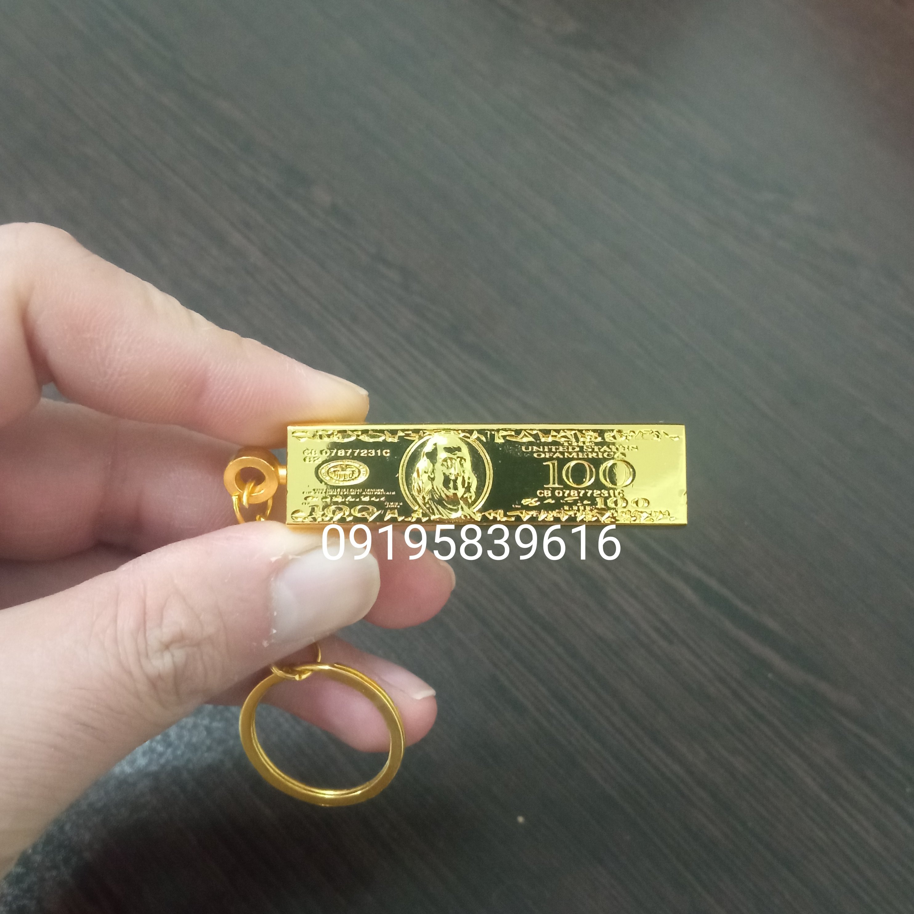 فندک روکش طلا طرح دلار همراه با جعبه و شناسنامه اصالت کالا