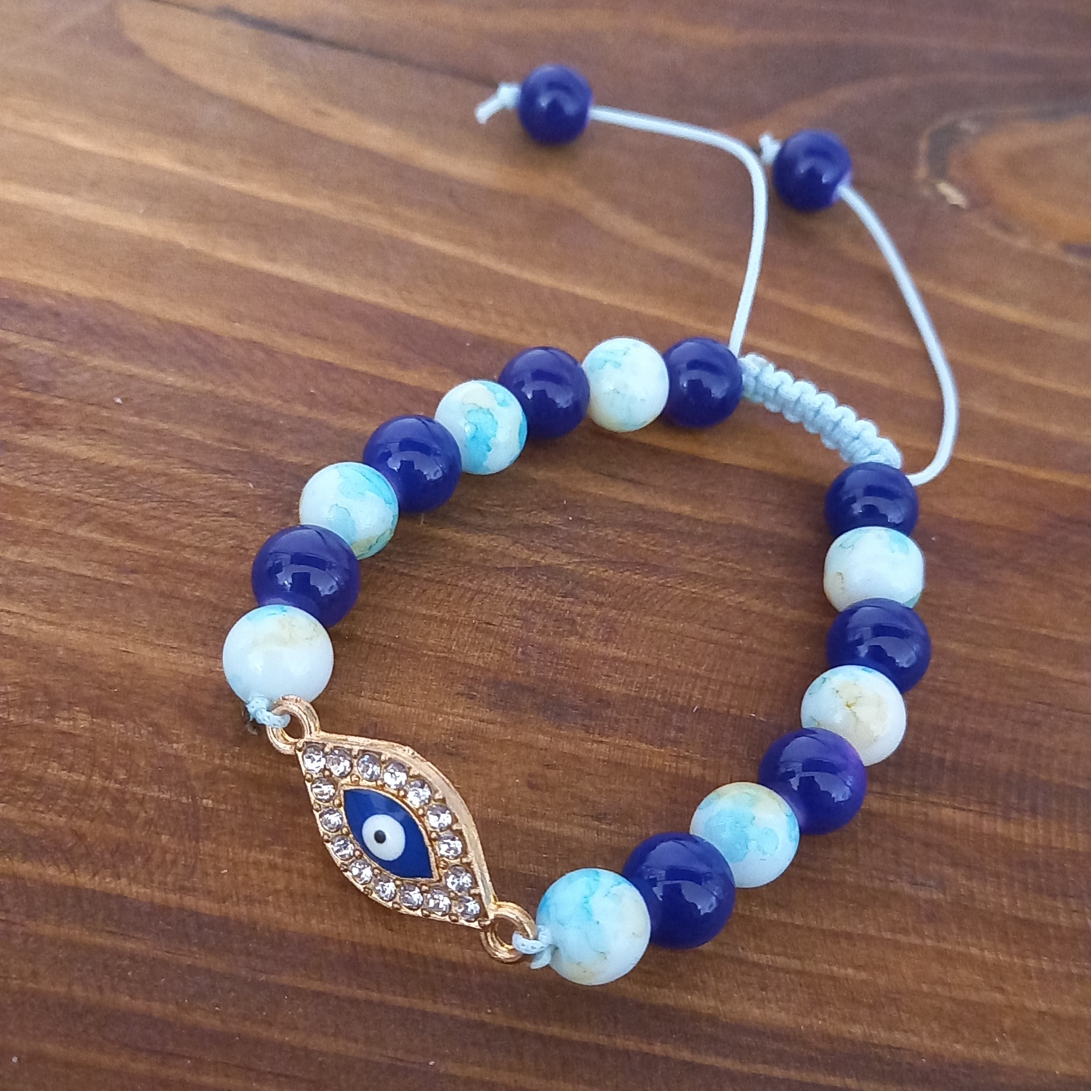 دستبند چشم نظر  آبی کاربنی  مهره های آبرنگی گره کشویی
