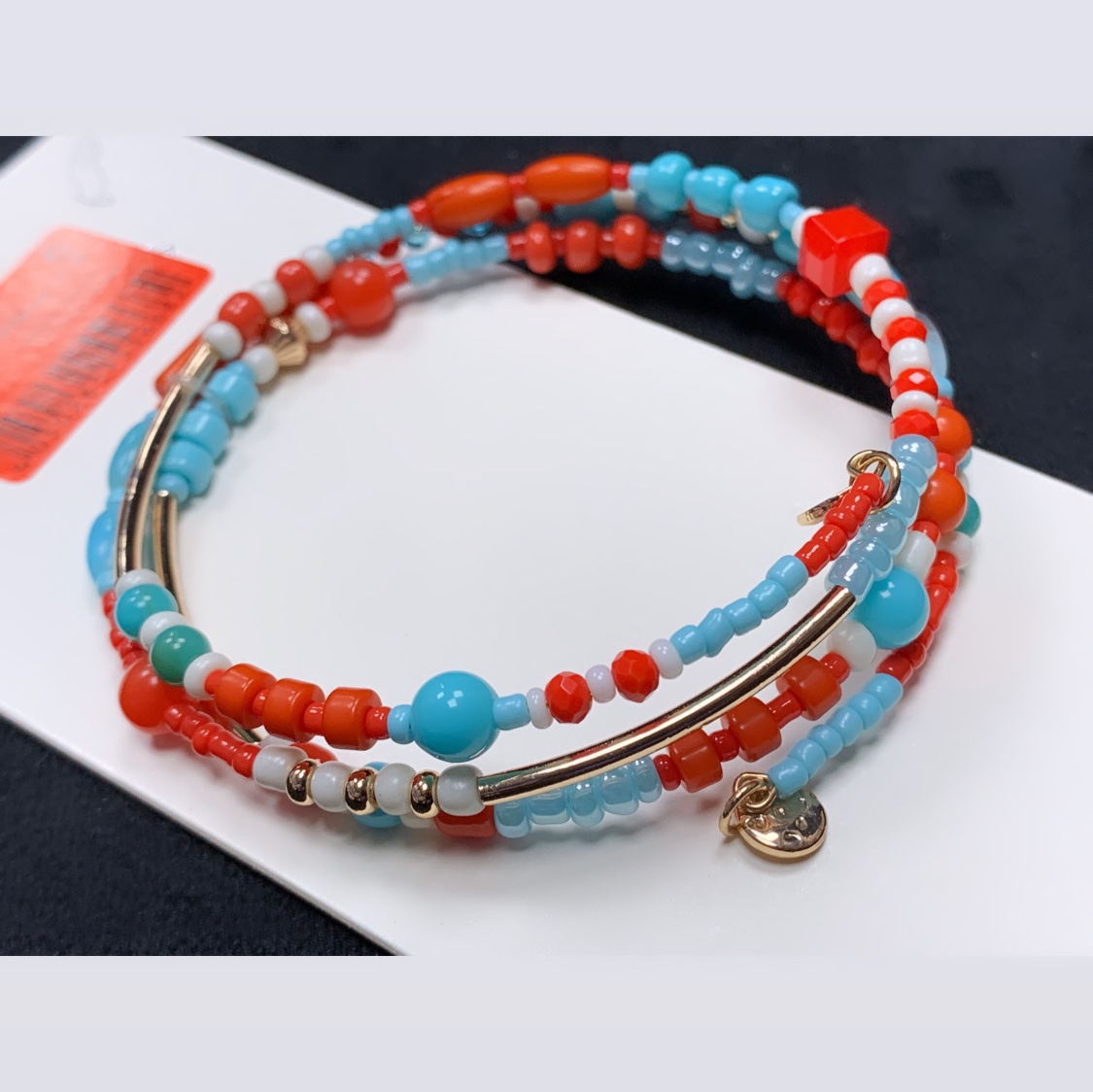 دستبند النگویی با ترکیب رنگ نارنجی آبی 