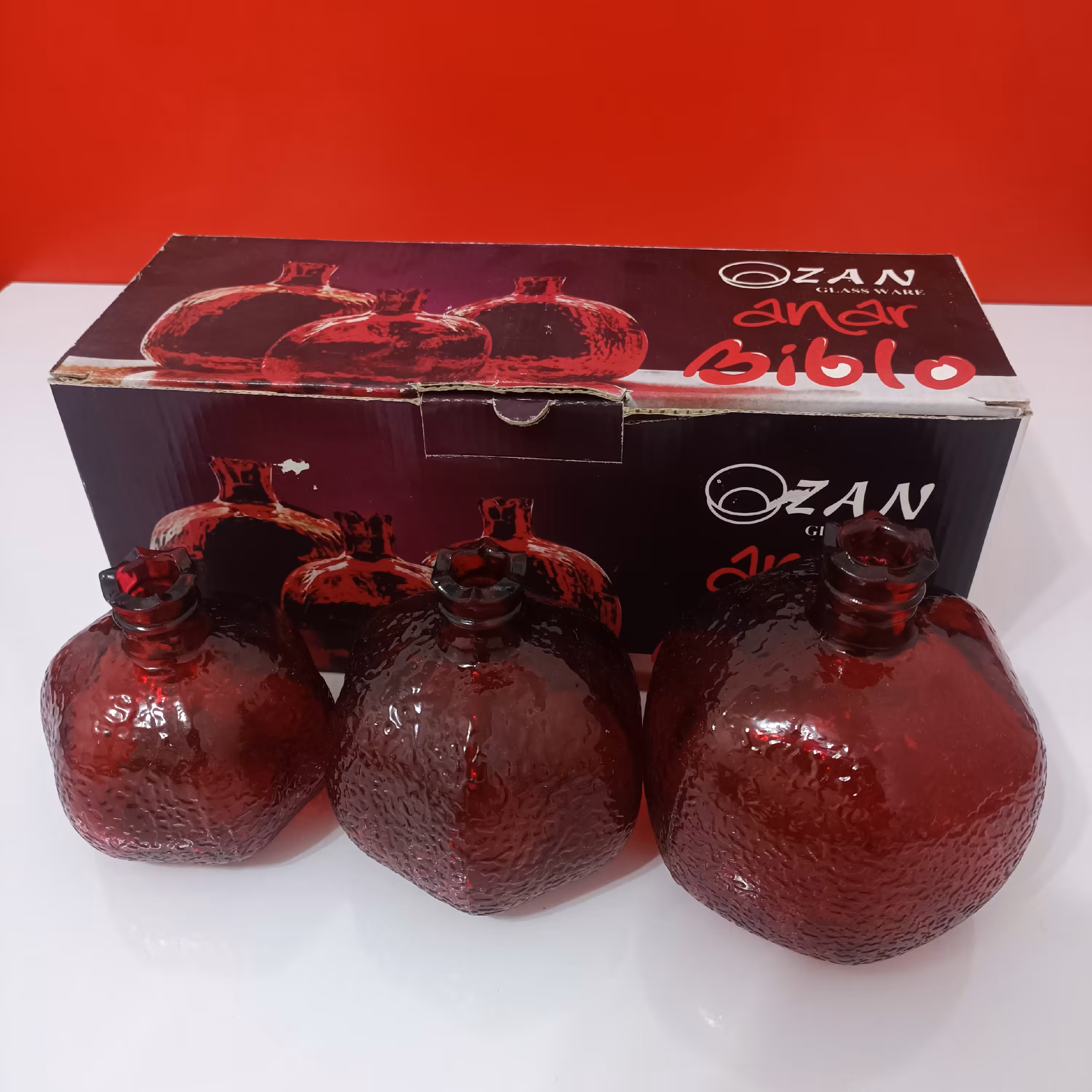 جا شمعی شیشه ای سه عددی قرمز رنگ