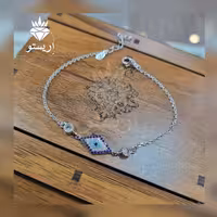دستبند نقره چشم نظر(چشم زخم) لوزی  با عیار 925 و آبکاری طلاسفید بسیار شیک