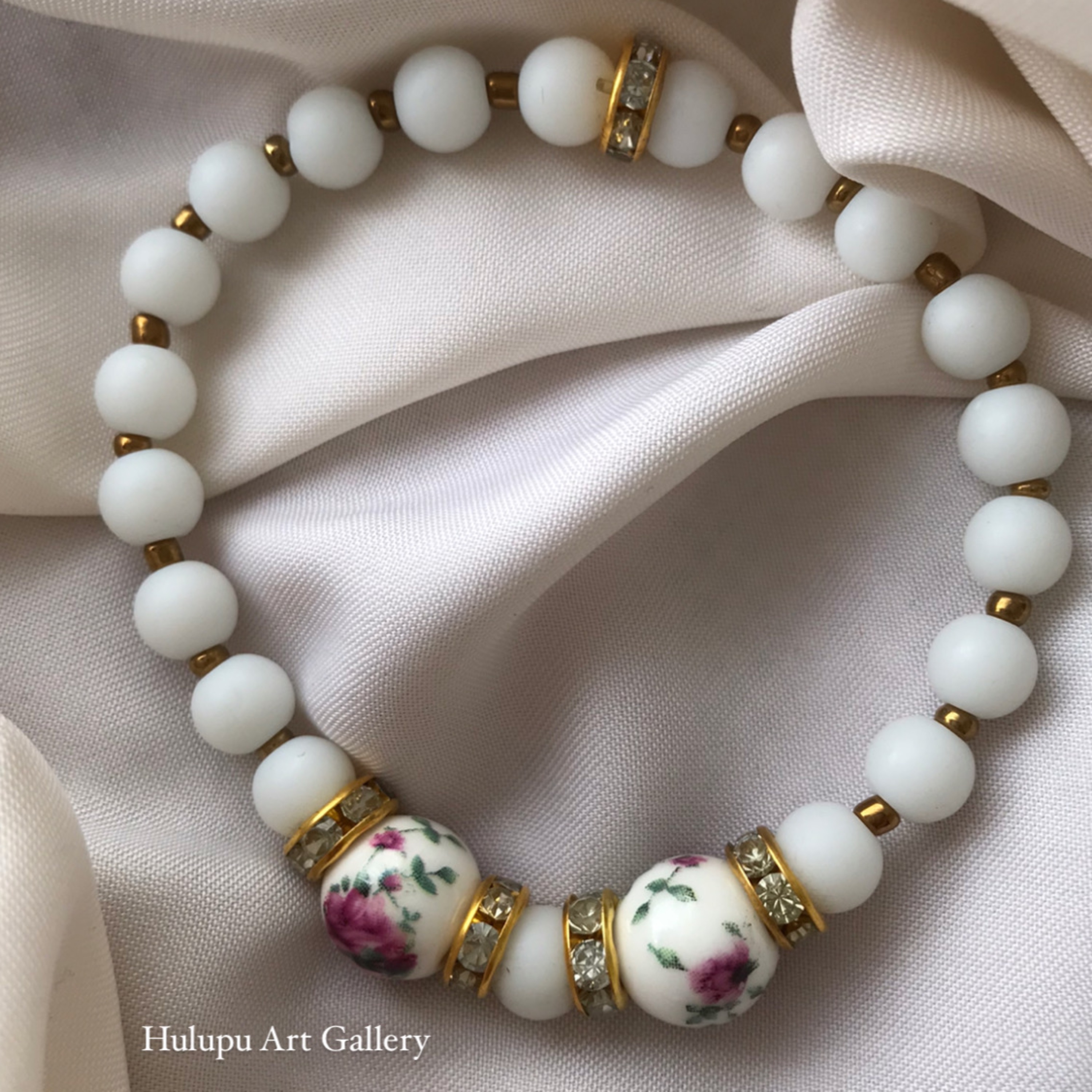 دستبند مهره گل سرخی از کالکشن دستبند گل سرخی