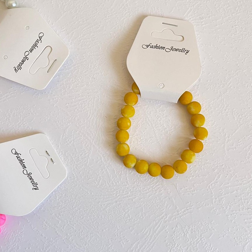 دستبند کشی  با مهره های زرد ابر و بادی
