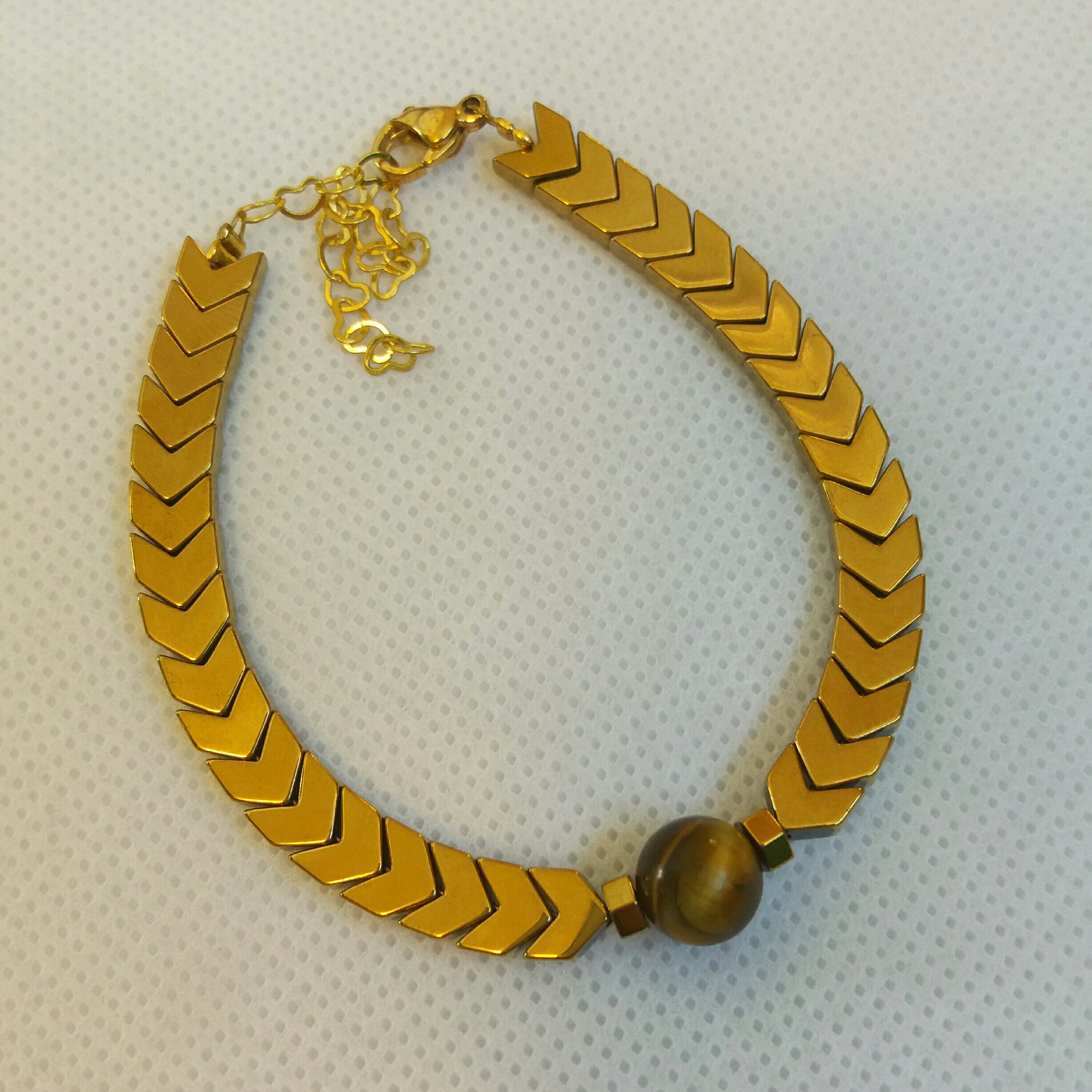 دستبند حدید فلش طلایی و سنگ چشم ببر