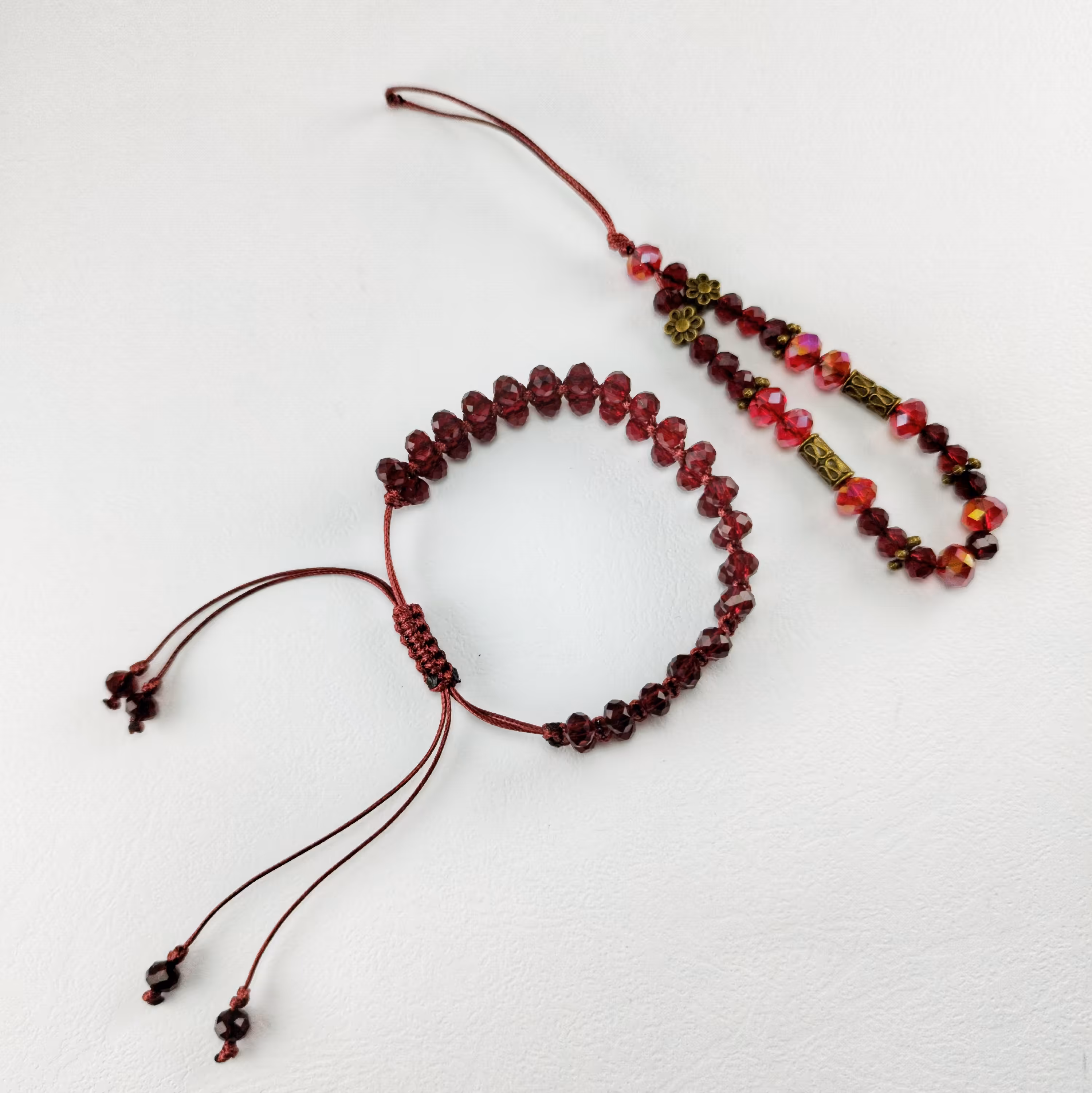 ست دستبند و آویز موبایل کریستالی دانه اناری با بند چرم