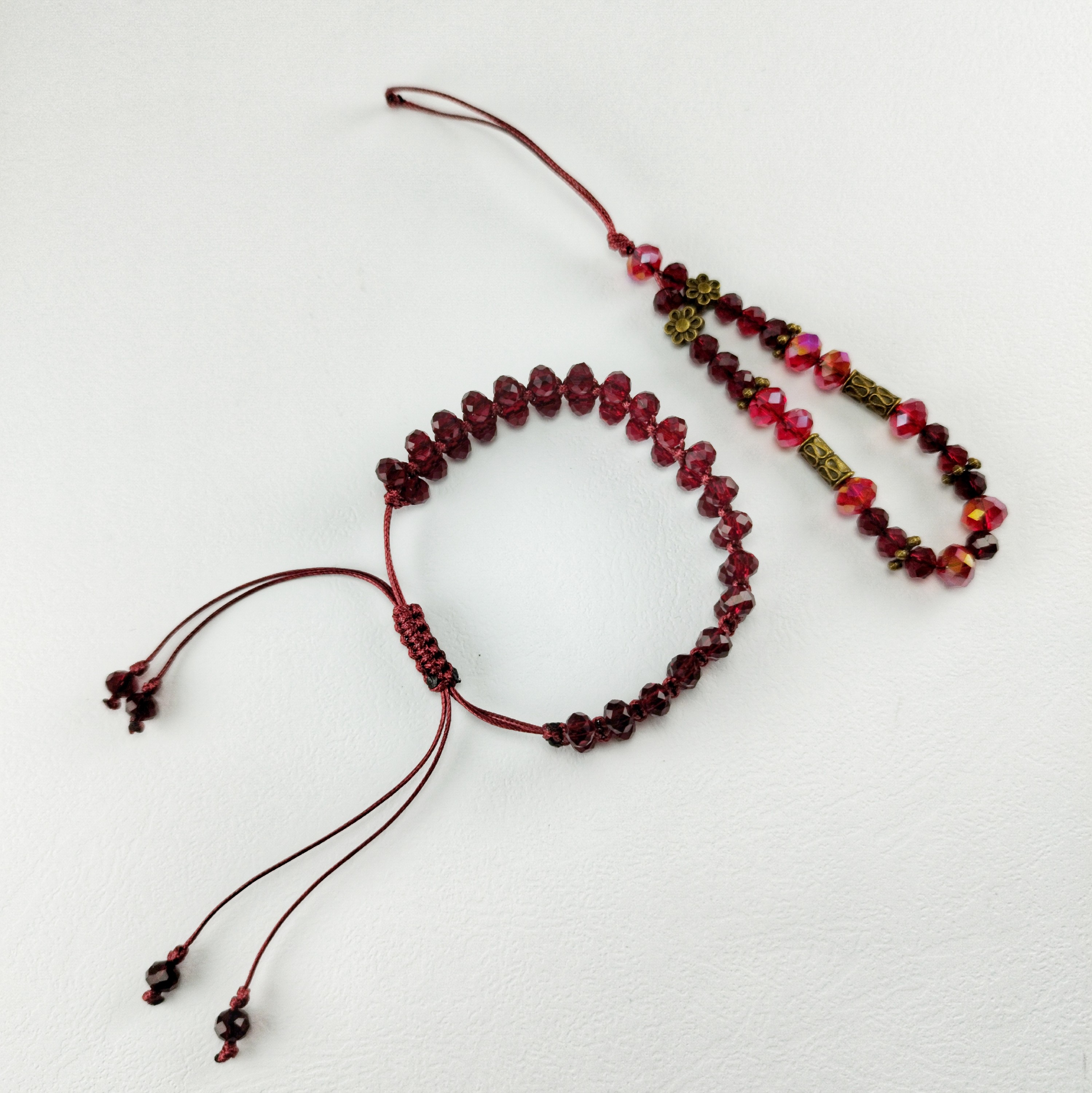 ست دستبند و آویز موبایل کریستالی دانه اناری با بند چرم