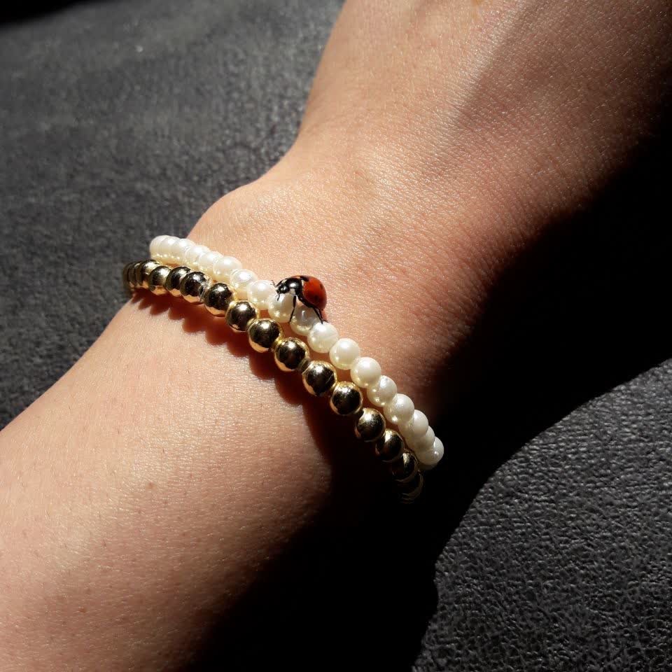 دستبند های مرواریدی و طلایی