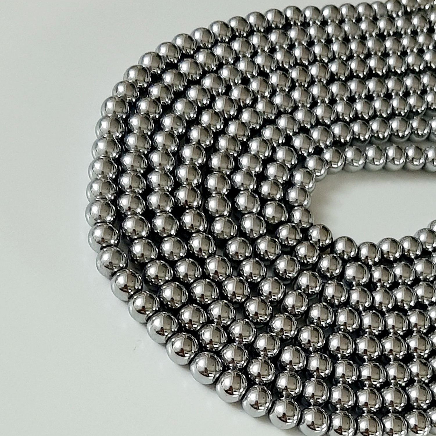 سنگ حدید نقره ای  سایز 8(فروش بصورت ریسه ای)