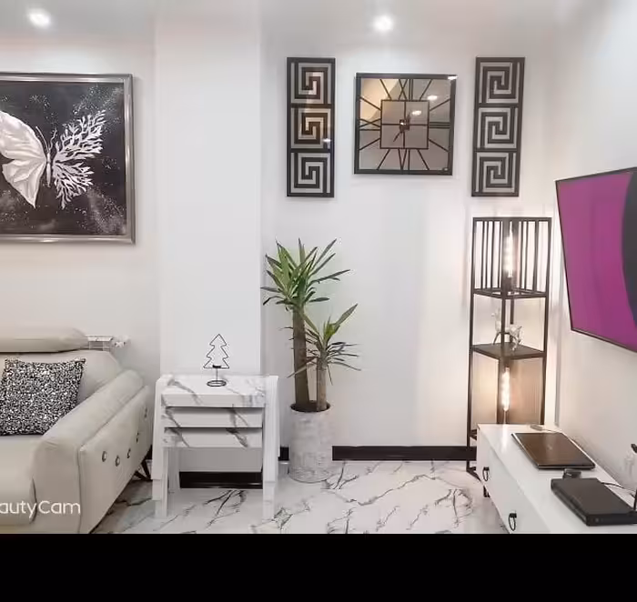 ساعت دیواری اینه گوشواره دار طرح گلچین