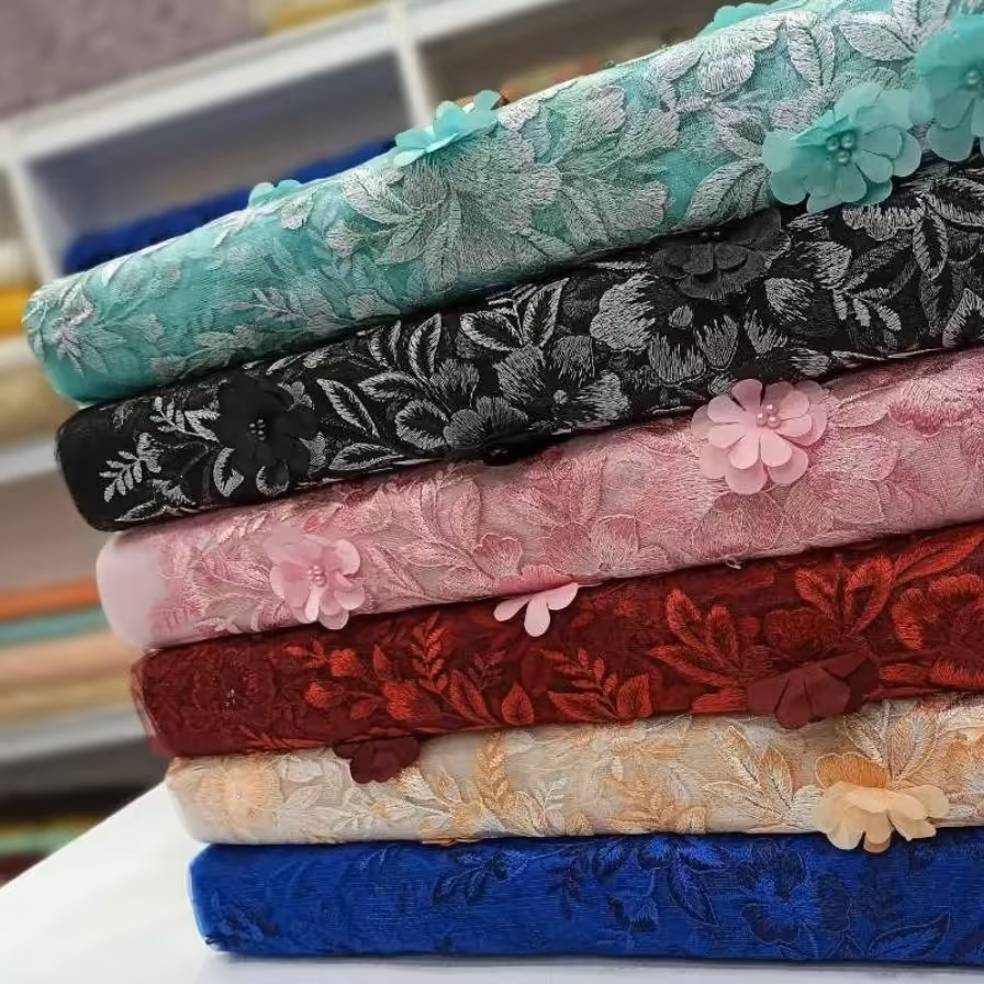 پارچه مجلسی کارشده با شکوفه و مروارید