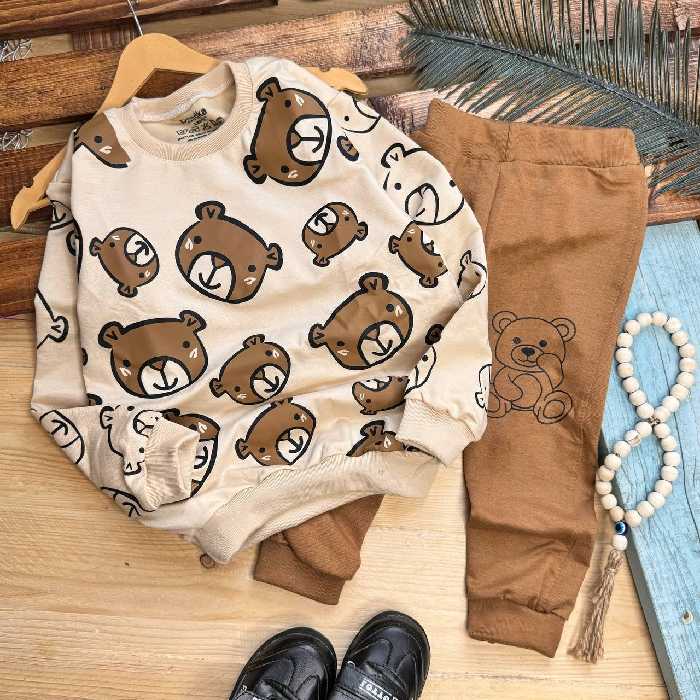 ست بلندلباس شلوار اسپورت بچه گانه کرمی کله خرسی شلوار  طرح markez اسپان لاکرا عالی سایز 40و45و50و55 ارسال رایگان 