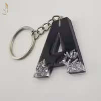 جاکلیدی رزینی حروف انگلیسی حرف A مشکی و ورق نقره ای کد 004