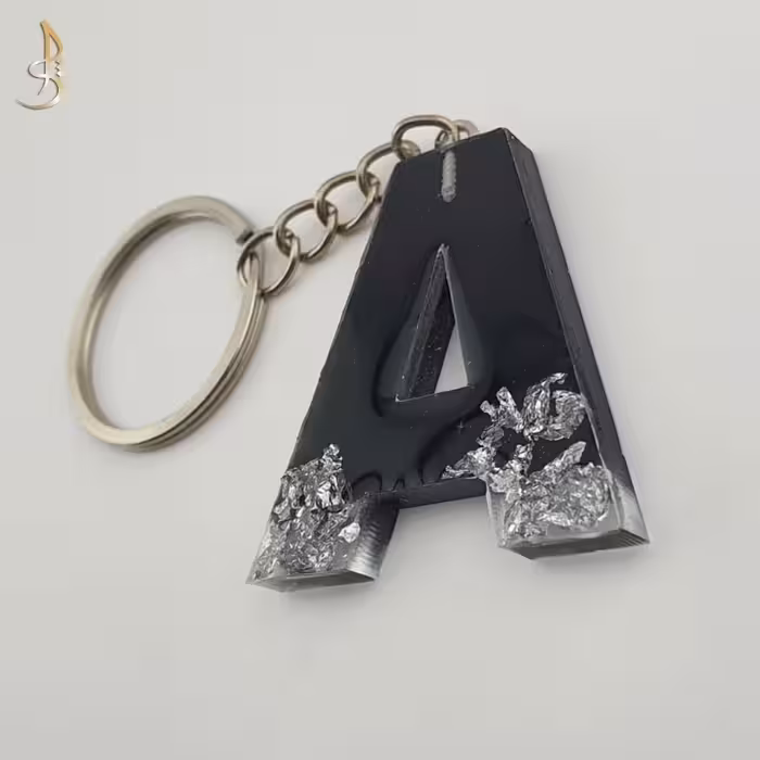 جاکلیدی رزینی حروف انگلیسی حرف A مشکی و ورق نقره ای کد 004