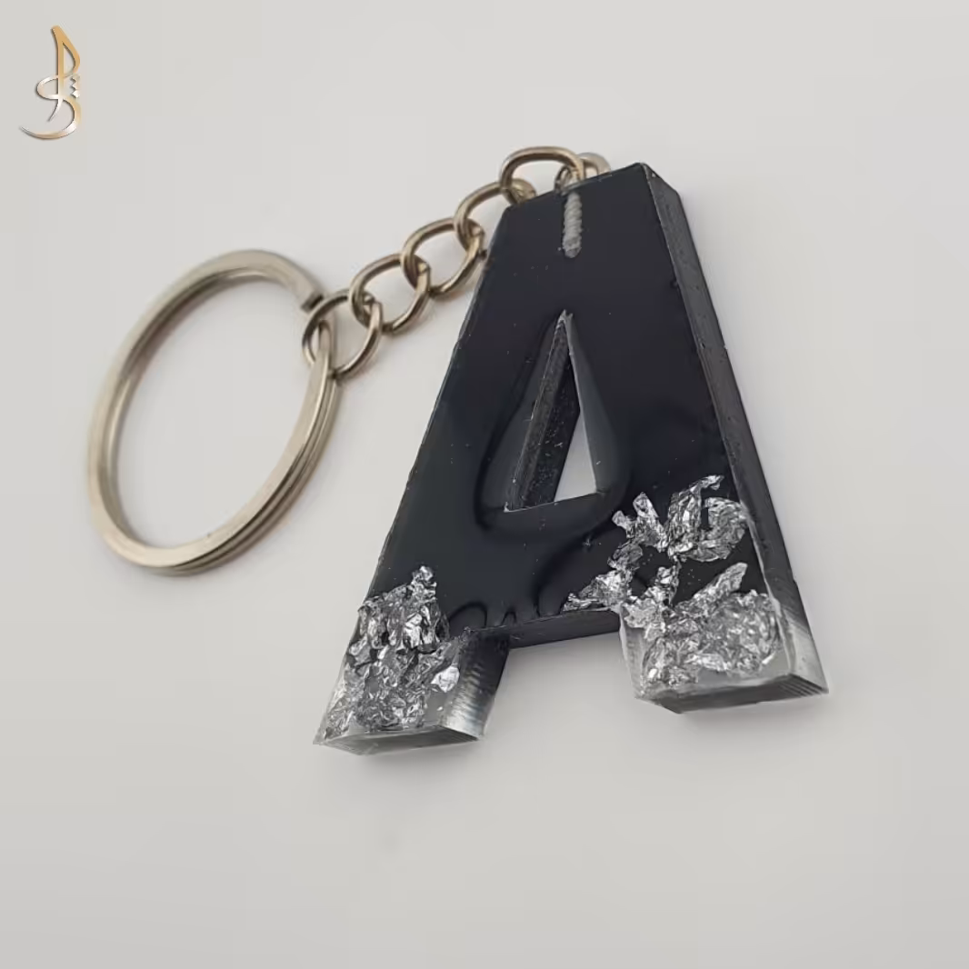 جاکلیدی رزینی حروف انگلیسی حرف A مشکی و ورق نقره ای کد 004
