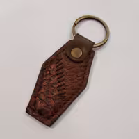 جاسوئیچی چرم طبیعی مدل تیکه دوزی - اکسسوری خاص - کد 4