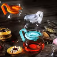 قوری زعفران جنس شیشه درب پلاستیکی رنگبندی سبز صورتی مشکی