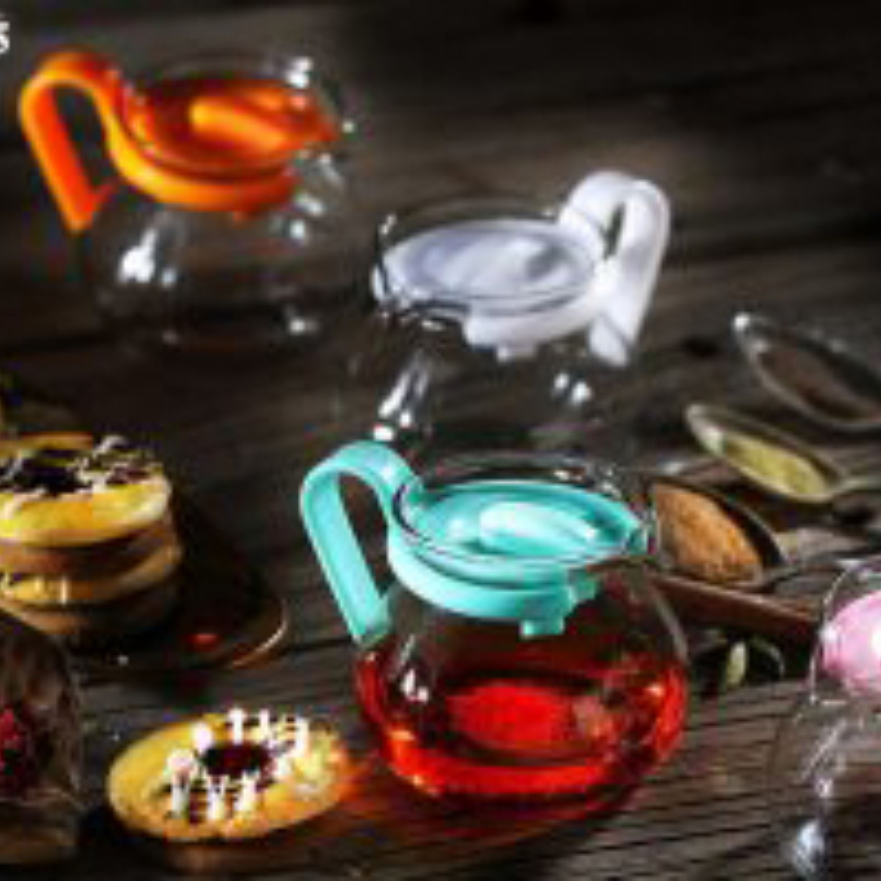 قوری زعفران جنس شیشه درب پلاستیکی رنگبندی سبز صورتی مشکی