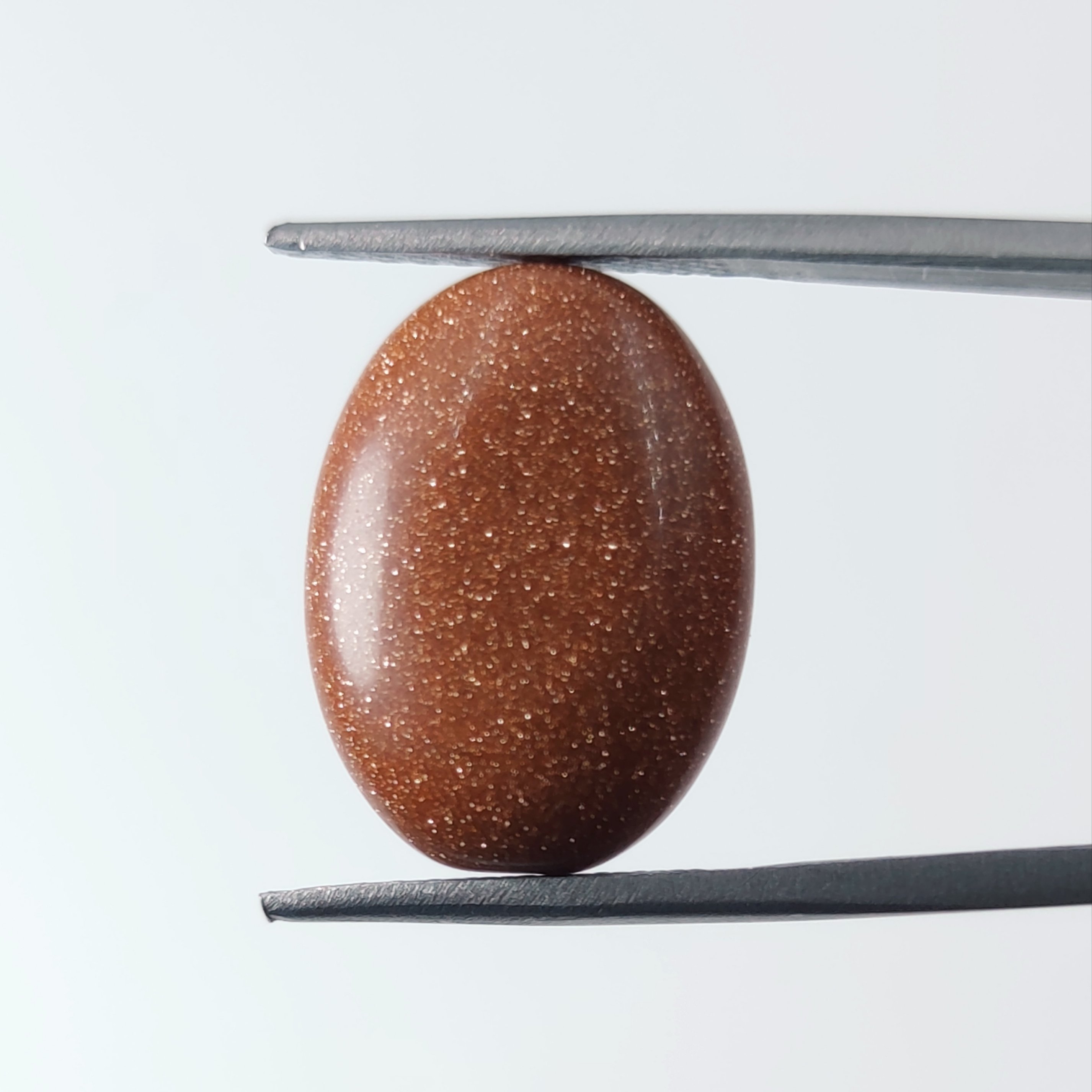 نگین تراش اوال سنگ دلربا طلایی-نارنجی 