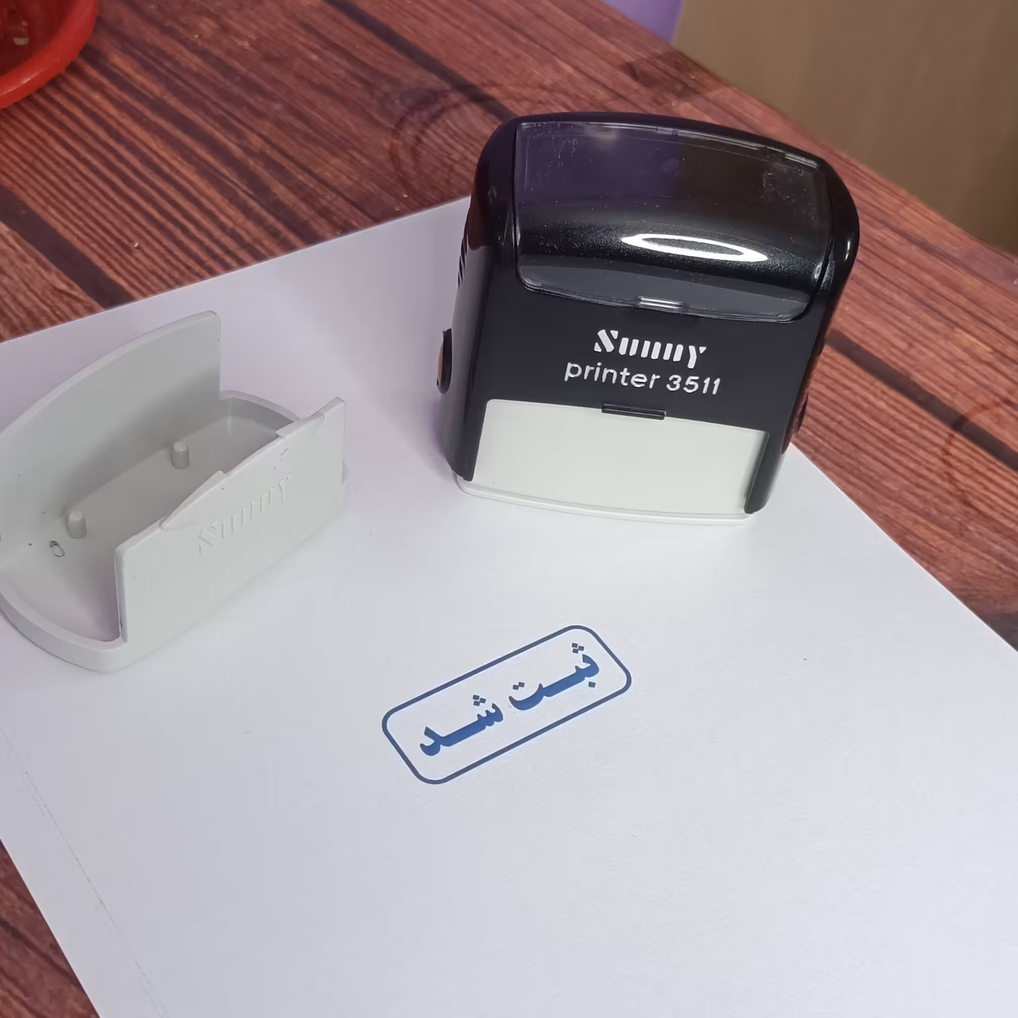 پایه مهر سانی طرح ثبت شد مدل 3511 رنگ جوهر آبی - رنگ دستگاه قرمز و مشکی و آبی