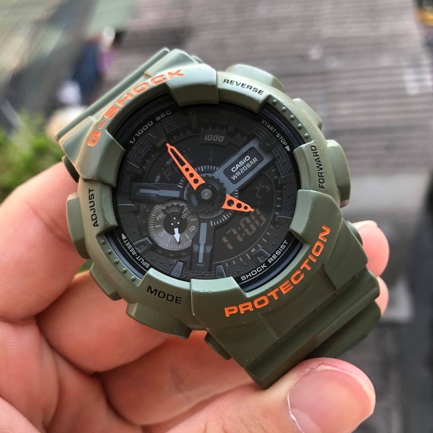ساعت مچی جی شاک GA110 سبز لجنی (جیشاک GShock) ، صد در صد ضدآب ، تنظیم اتوماتیک با پایتخت کشورها ، اتولایت دار