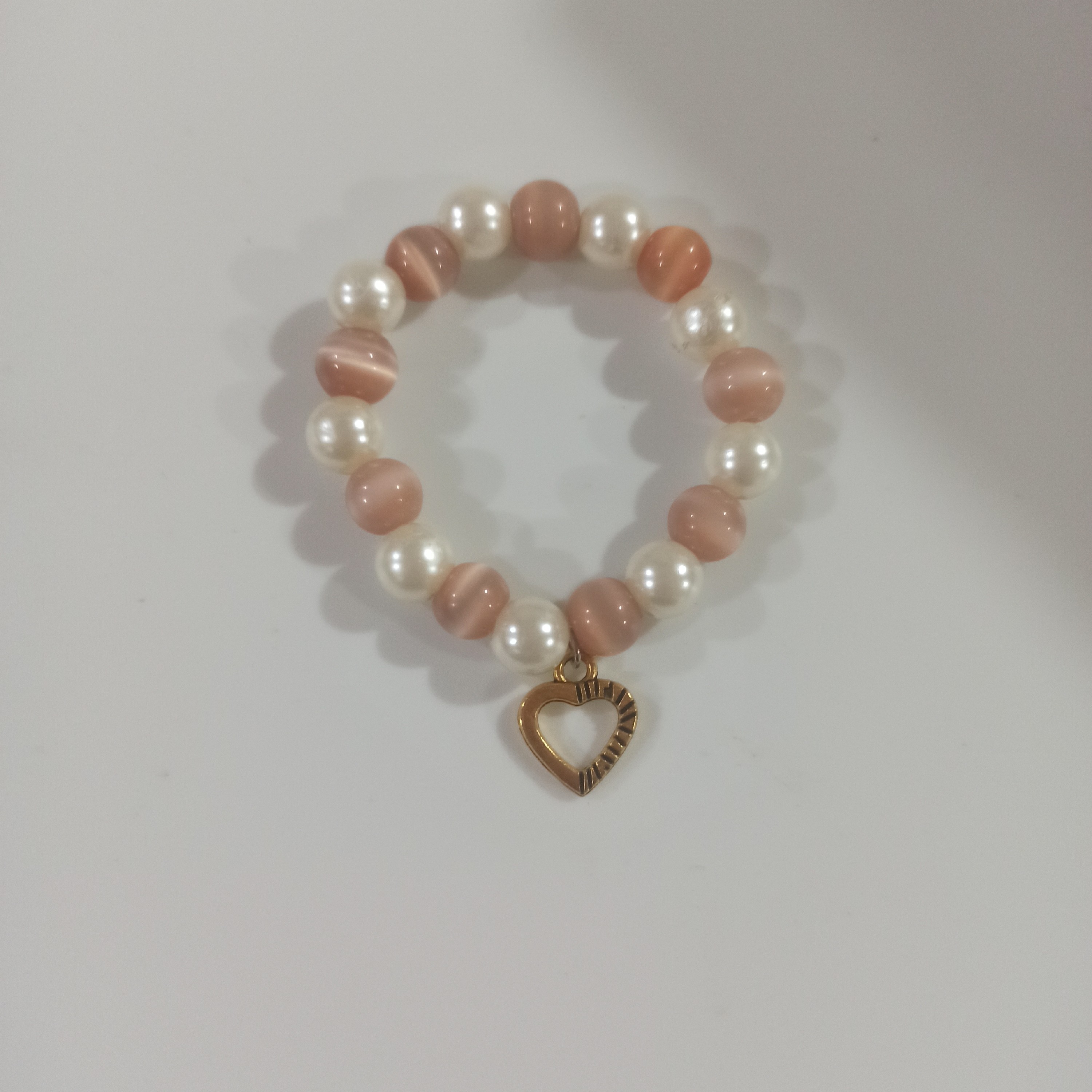 دستبند  سنگ سیموفن(چشم گربه) و مروارید طرح قلب طلایی 