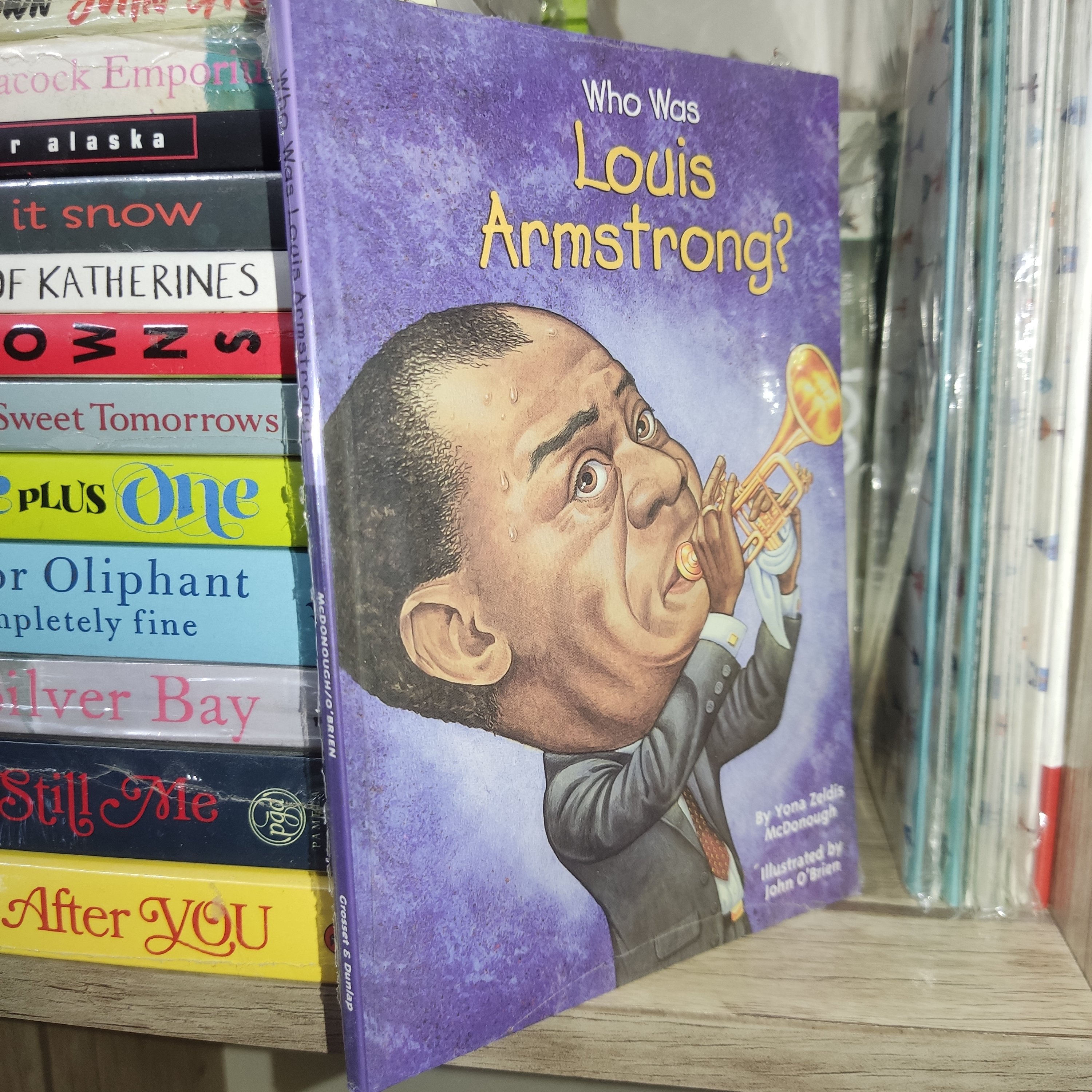 کتاب زبان اصلی Who Was Louis Armstrong? (لوئیز آرمسترانگ که بود؟) - اثر یونا زلدیس