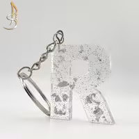 جاکلیدی رزینی حروف انگلیسی ورق و اکلیل نقره ای حرف R (کد 001)