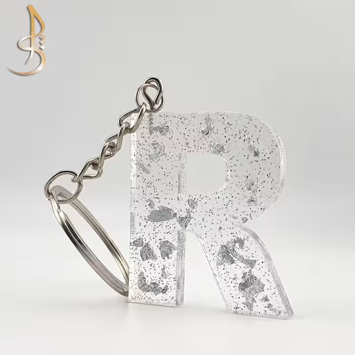 جاکلیدی رزینی حروف انگلیسی ورق و اکلیل نقره ای حرف R (کد 001)