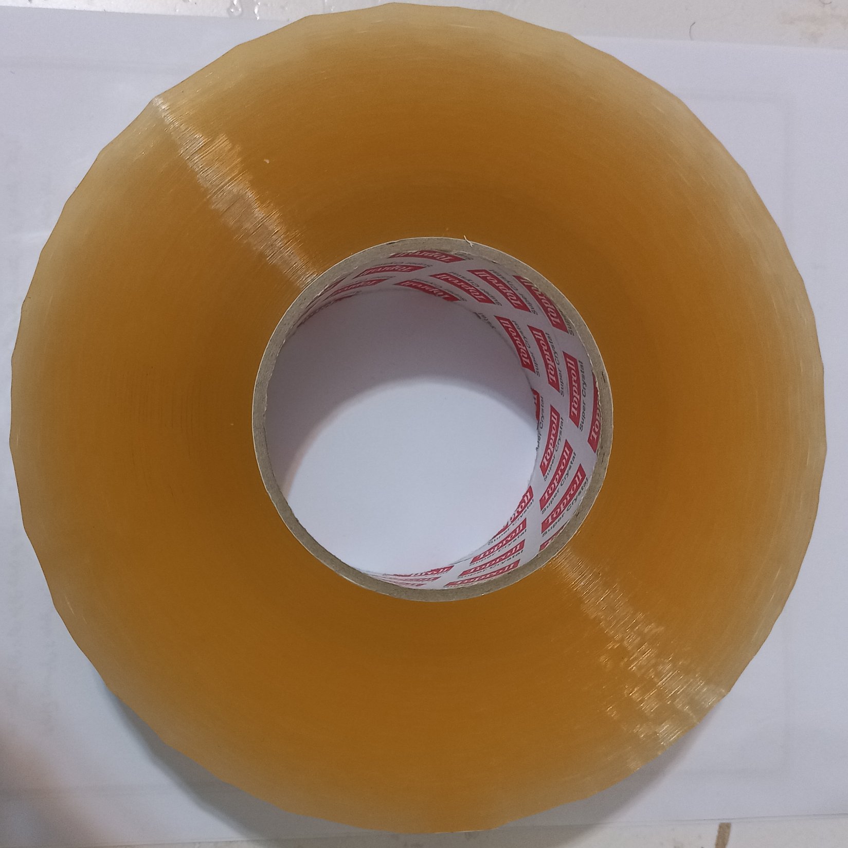 چسب 5 سانتی شیشه ای ، برند تاپ رول ، کیفیت عالی ، 500 یاردی ، وزن 975 گرم ، قطر رول 18 سانتی متر