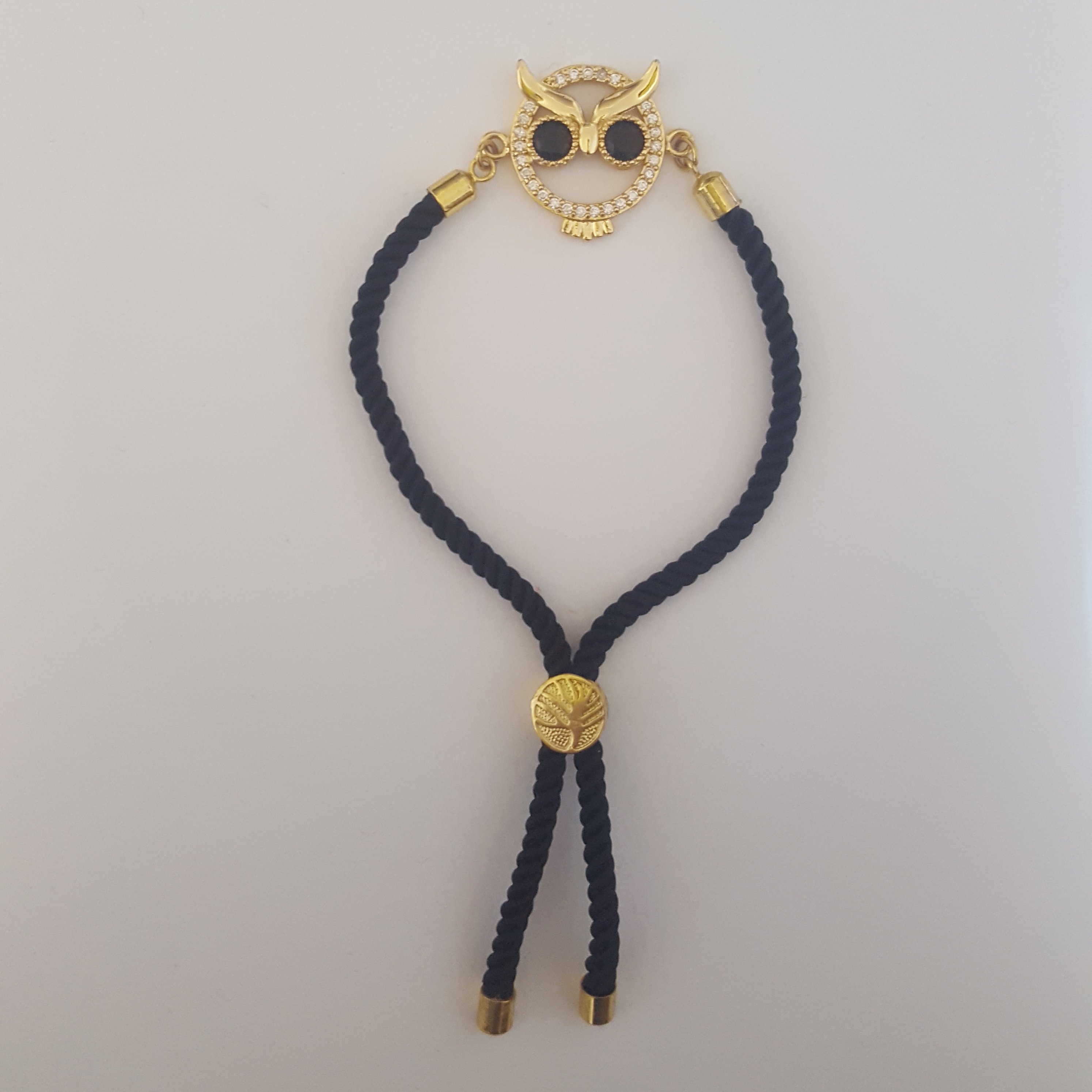 دستبند جغد سواروسکی آسانسوری مشکی نگین دار رنگ ثابت