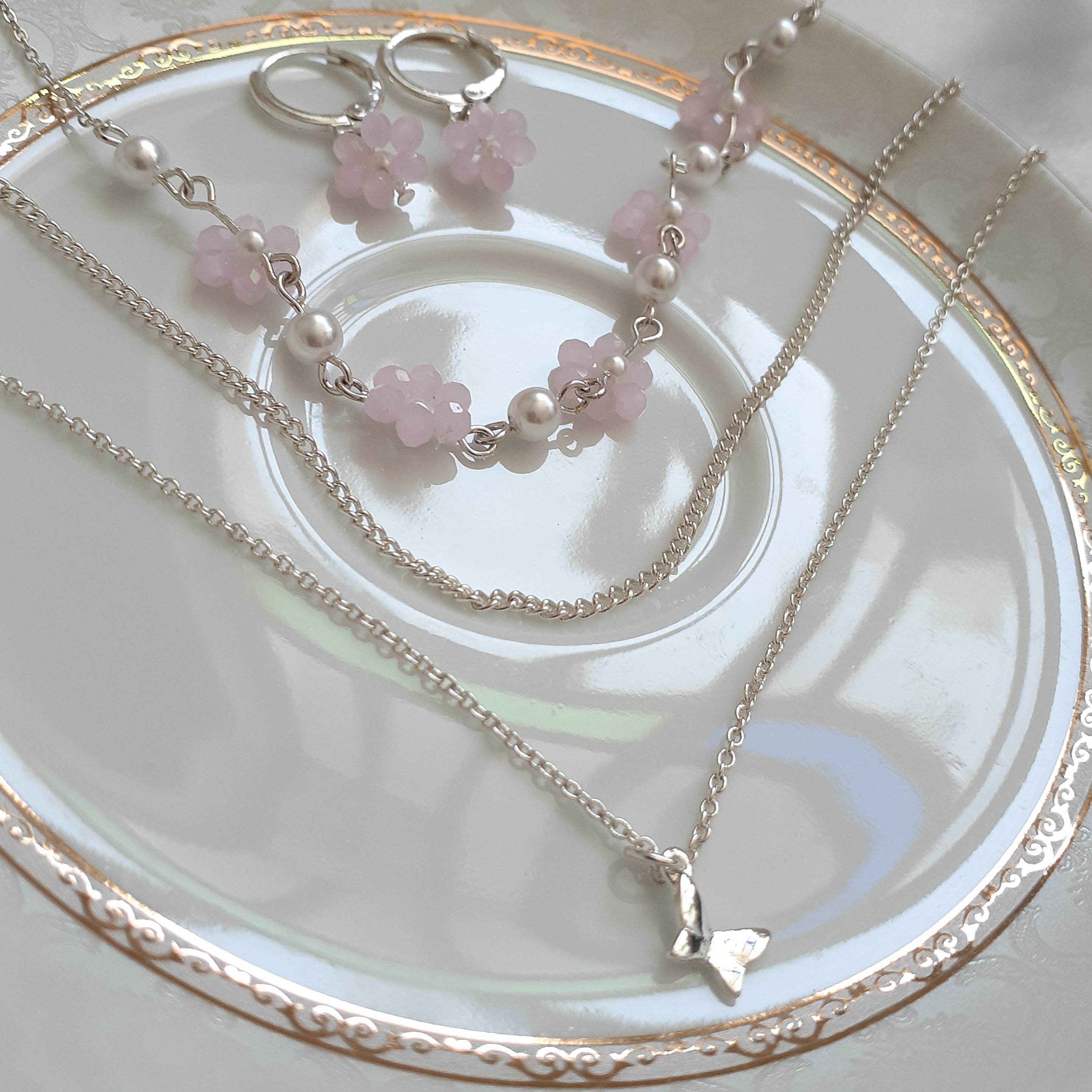 نیم ست استیل روکش نقره . گردنبند سه لاین و گوشواره. کریستال رنگ صورتی