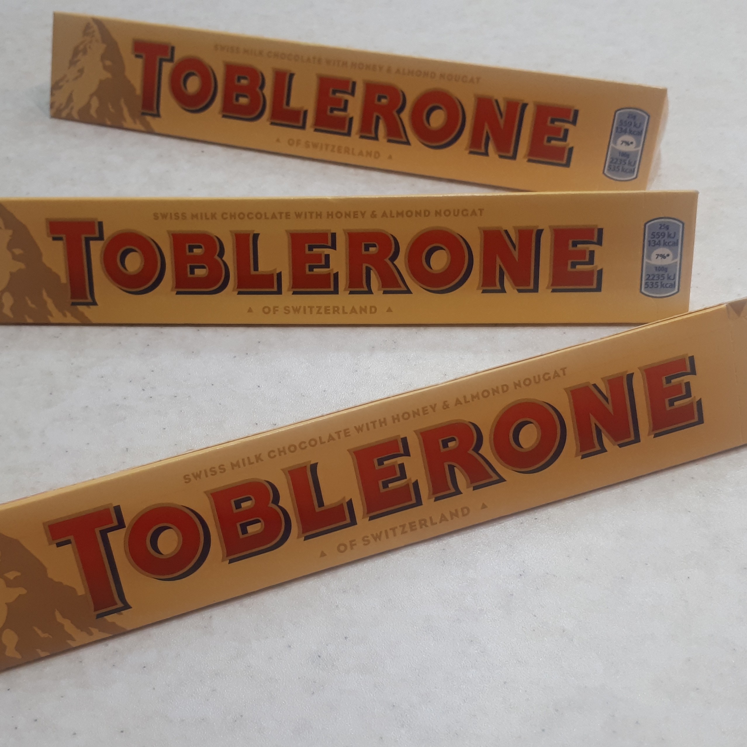 شکلات تابلرون اصل 100 گرمی با مغز عسل و بادام