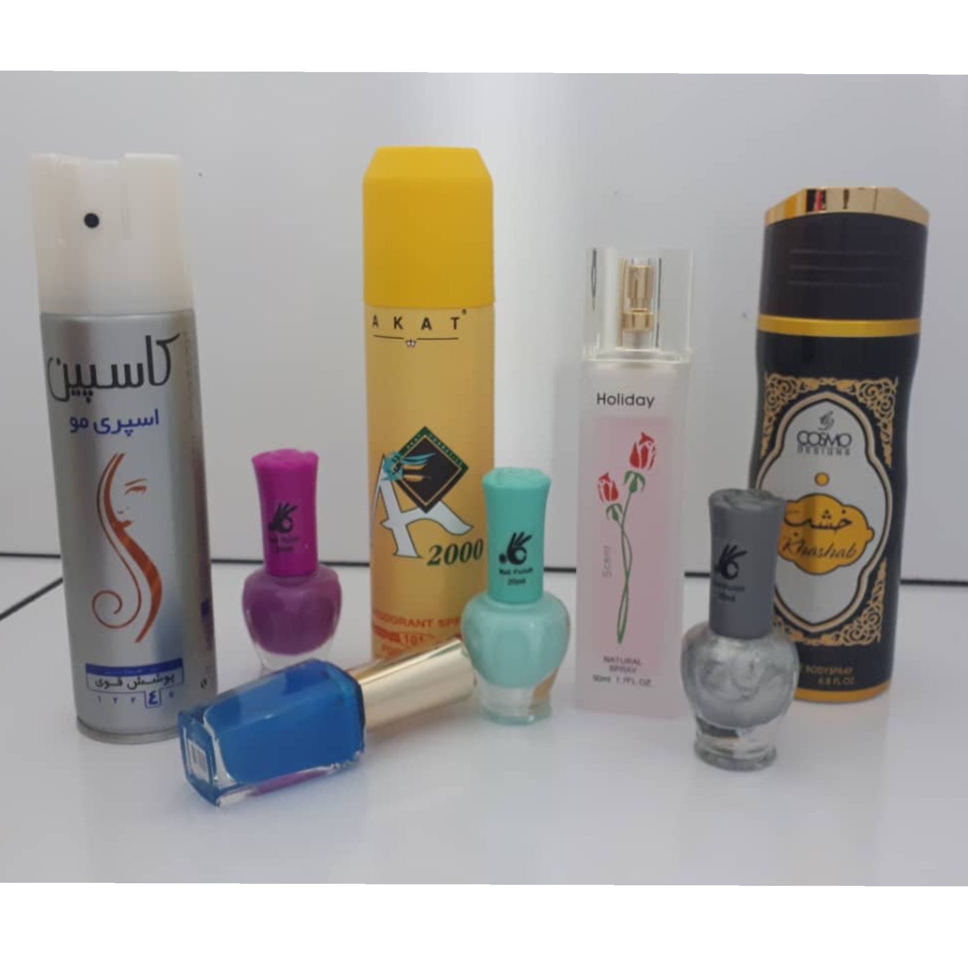 پک 8 عددی آکات زرد و لاک و تافت مو و ادکلن و اسپری خوشبو کننده
