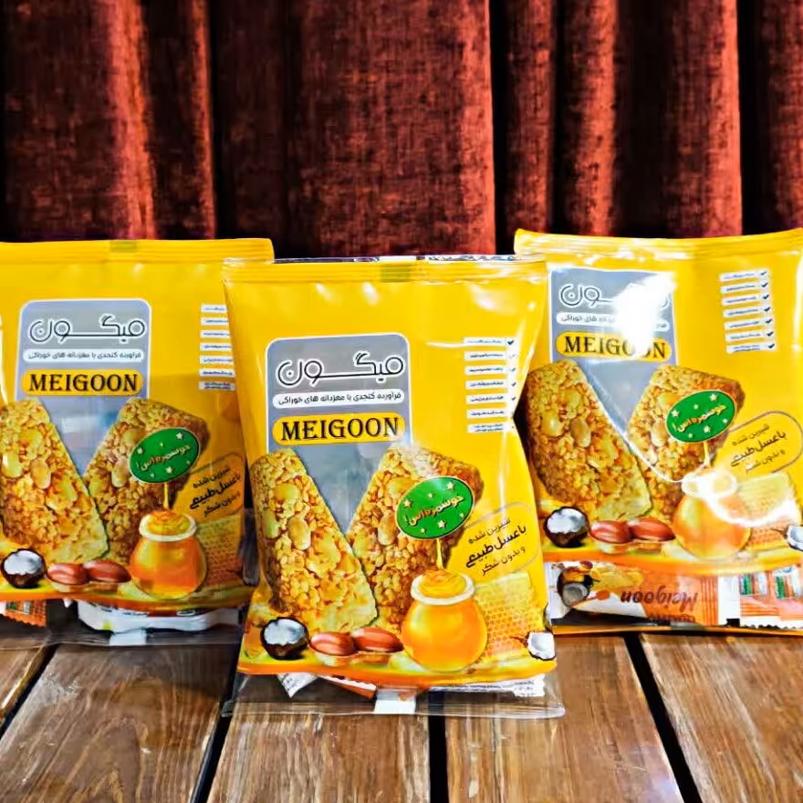 شکلات عسلی  میگون حاوی کنجد پوست کنده و مغریجات بسته 130 گرمی