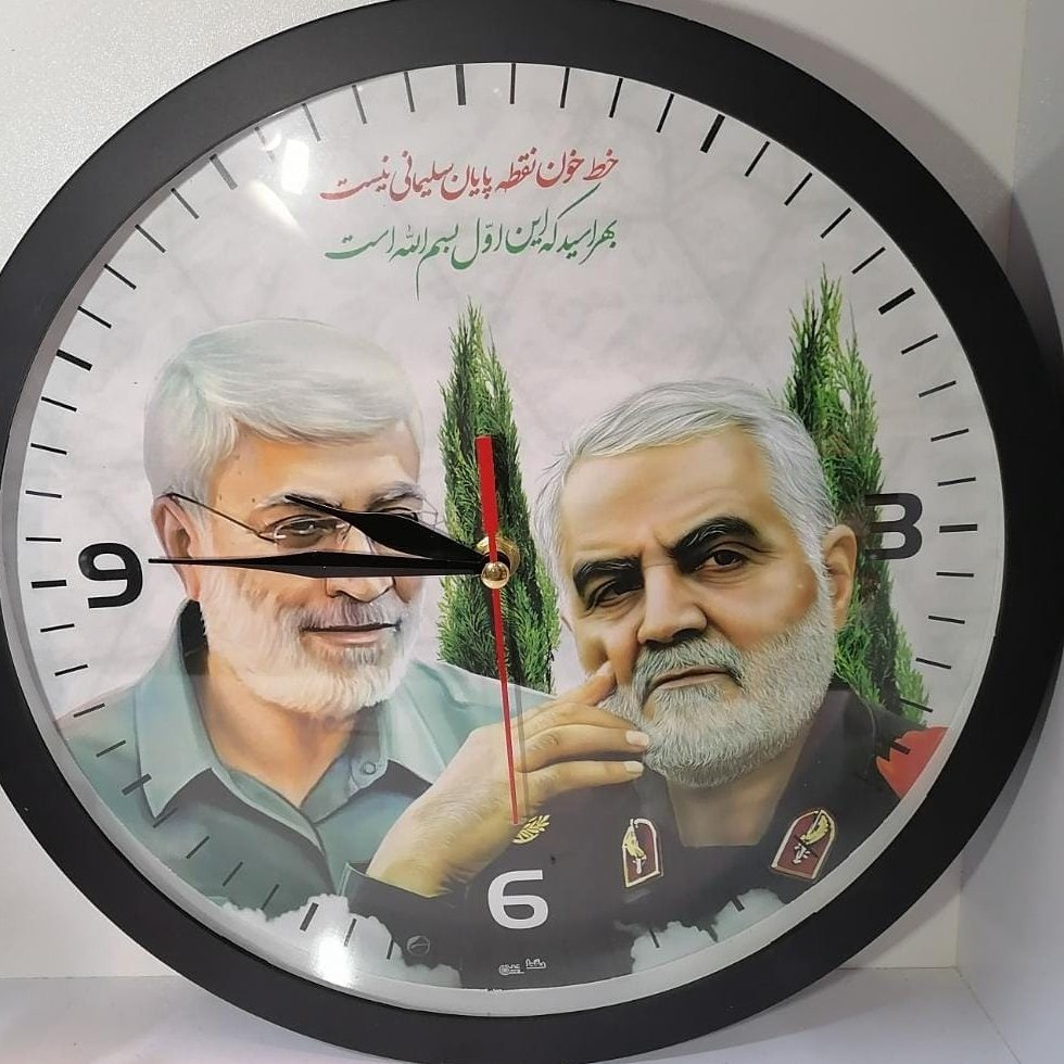 ساعت دیواری گرد طرح شهید حاج‌قاسم و ابومهدی المهندس