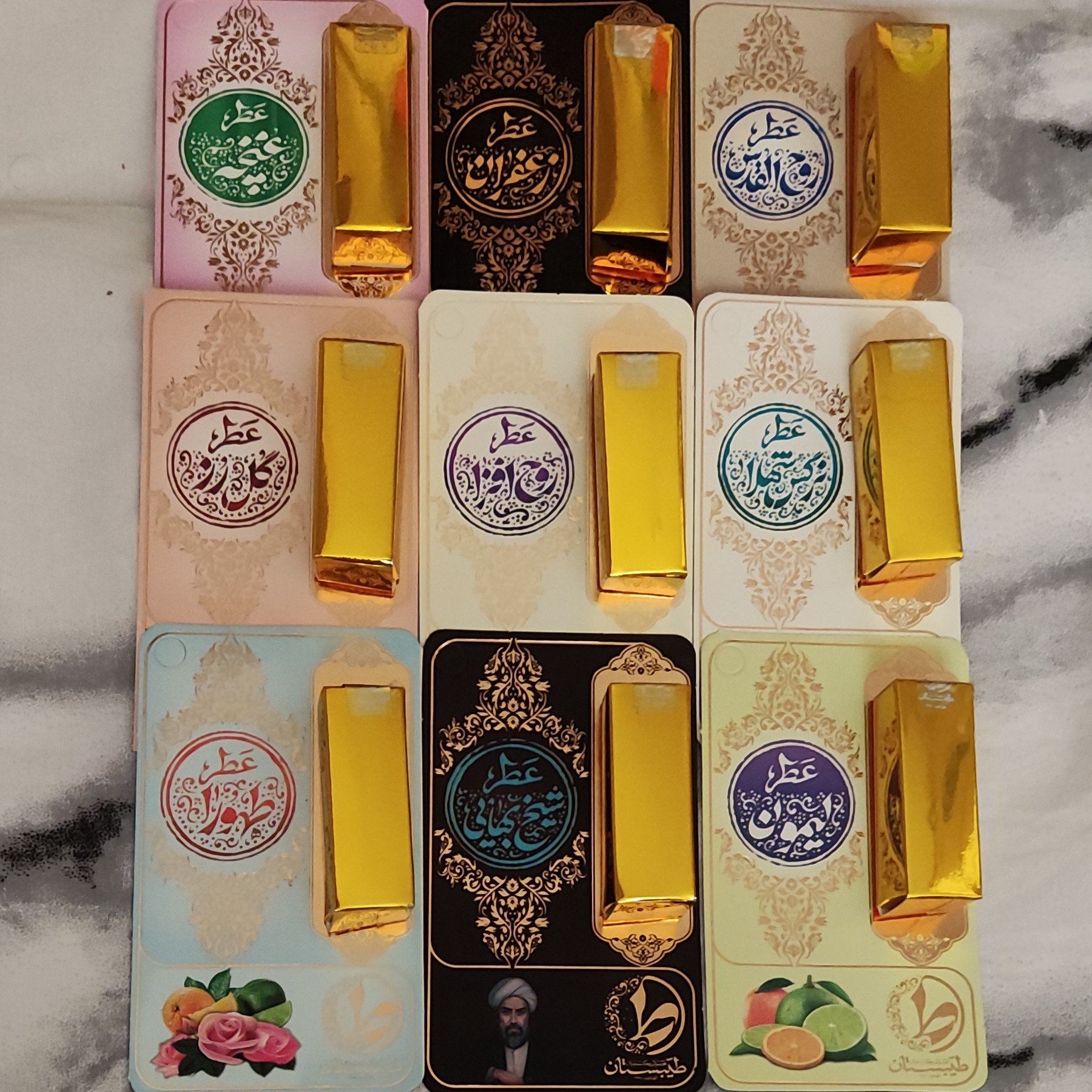 پک 9 تایی عطر  طبیعی یک گرمی طیبستان شامل غنچه محمدی، لیمون، نرگس، شیخ بهایی، روح افزا، گل رز، زعفران، طهورا، روح القدس