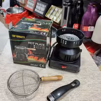 ذغال سوز برقی دارای توری دسته چوبی