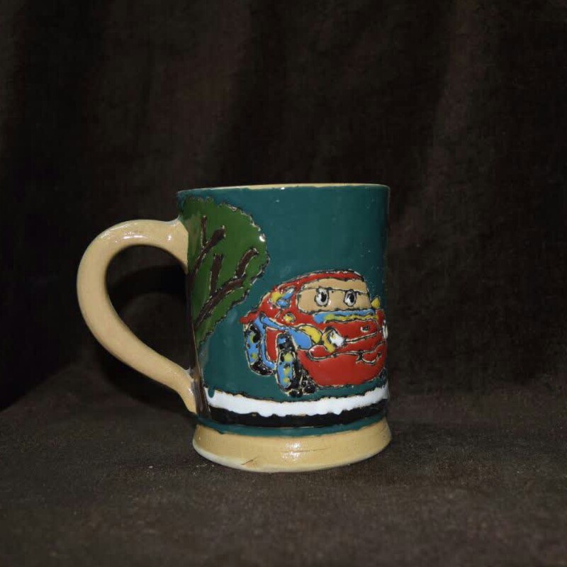 ماگ دسته دار.سفالی.رنگ کله غازی.طرح ماشینها.میناکاری.