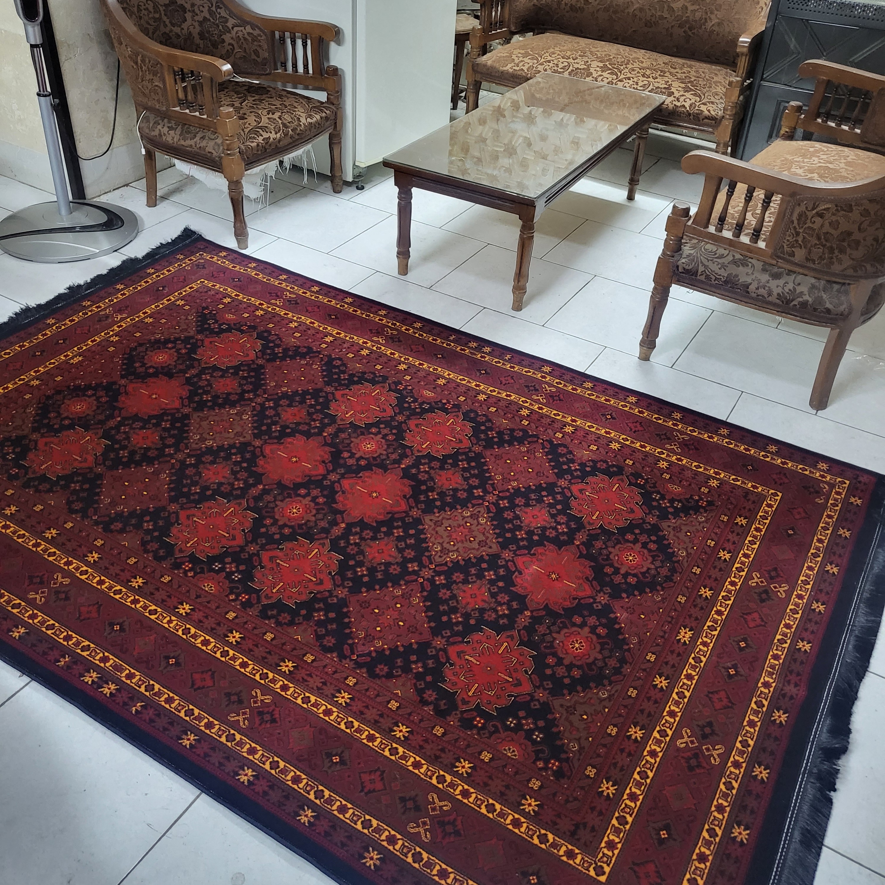 فرش ماشینی بلوچ 700شانه طرح لادن زمینه سرمه ای سایز 4متری