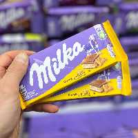 شکلات میلکا کرم بیسکوئیت 