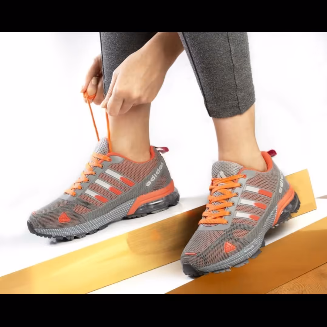 کفش کتونی آدیداس کپسولی زنانه دخترانه طوسی نارنجی با رویه تنفسی